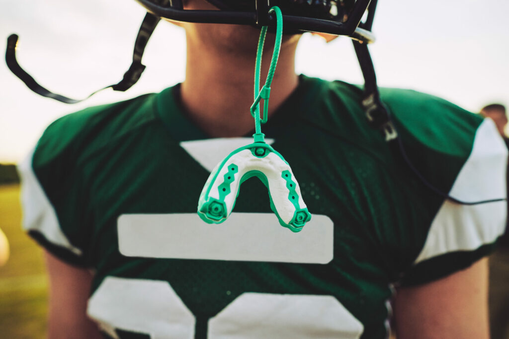 Why Your Child’s Fall Sports Require More Than Just a Helmet: The Custom Mouthguard Advantage